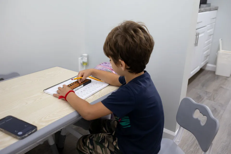 Boy learning Abacus Mental Math