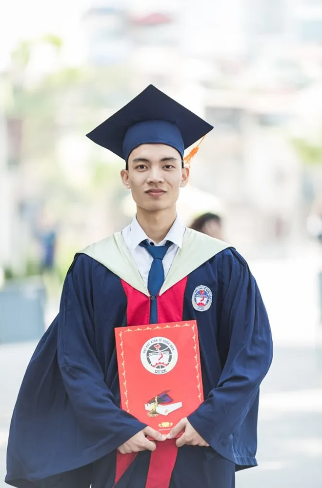 Graduate holding a diploma